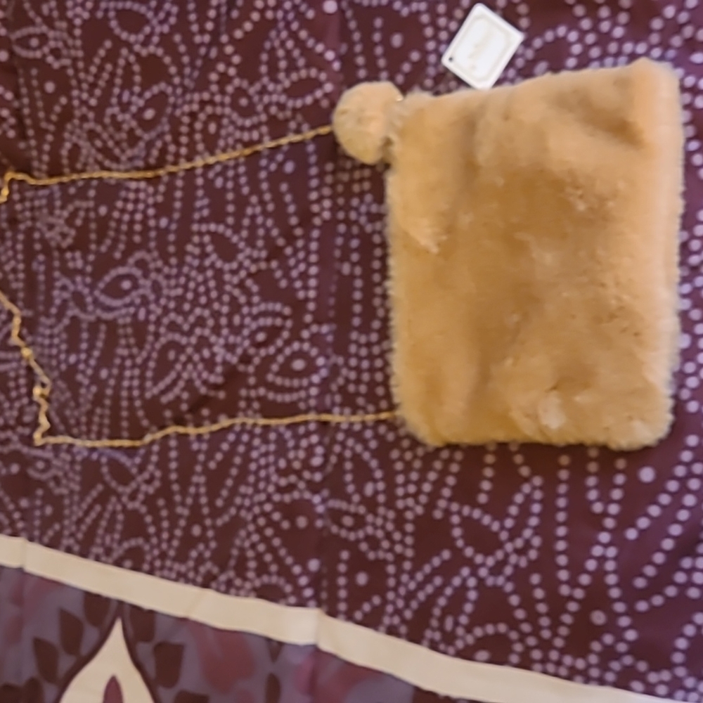 Faux Fur small shoulder bag or makeup bag.